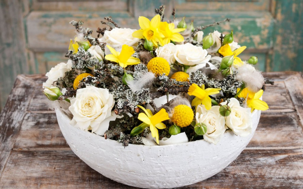 Daffodils and white roses floral arrangement centerpiece