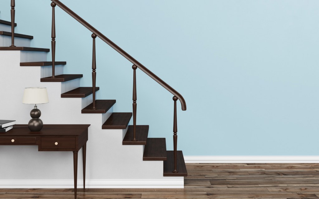 Classic staircase with black risers and banister