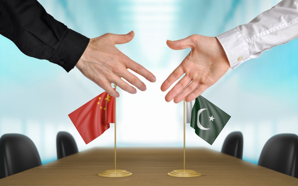 Hands of Pakistani and Chinese diplomats