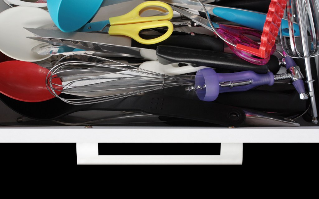 Junk drawer with kitchen utensils