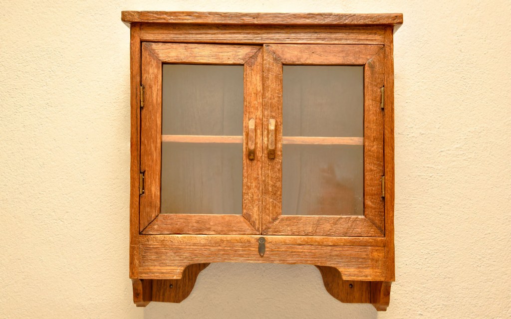 Wooden cabinet with glass panels
