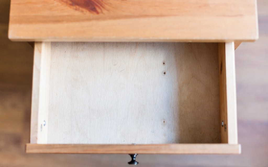An open wooden drawer