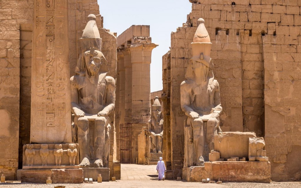 The entrance to Luxor Temple is guarded by huge statues