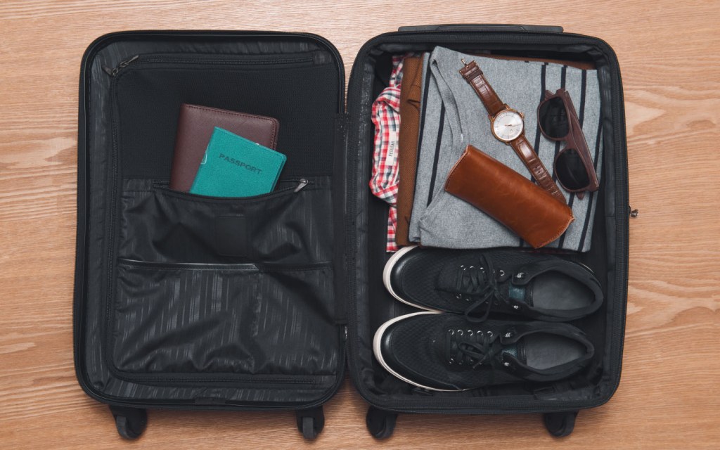 Place your heaviest items, like shoes, at the bottom of the suitcase, near the wheels