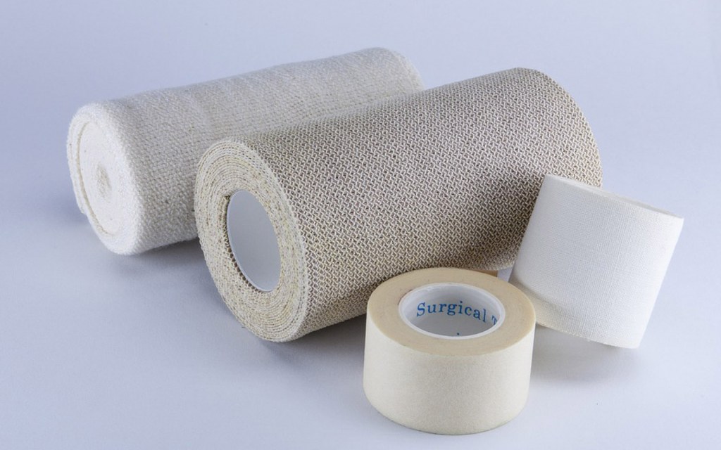 Surgical Tape is the best choice to hold an elastic bandage in place