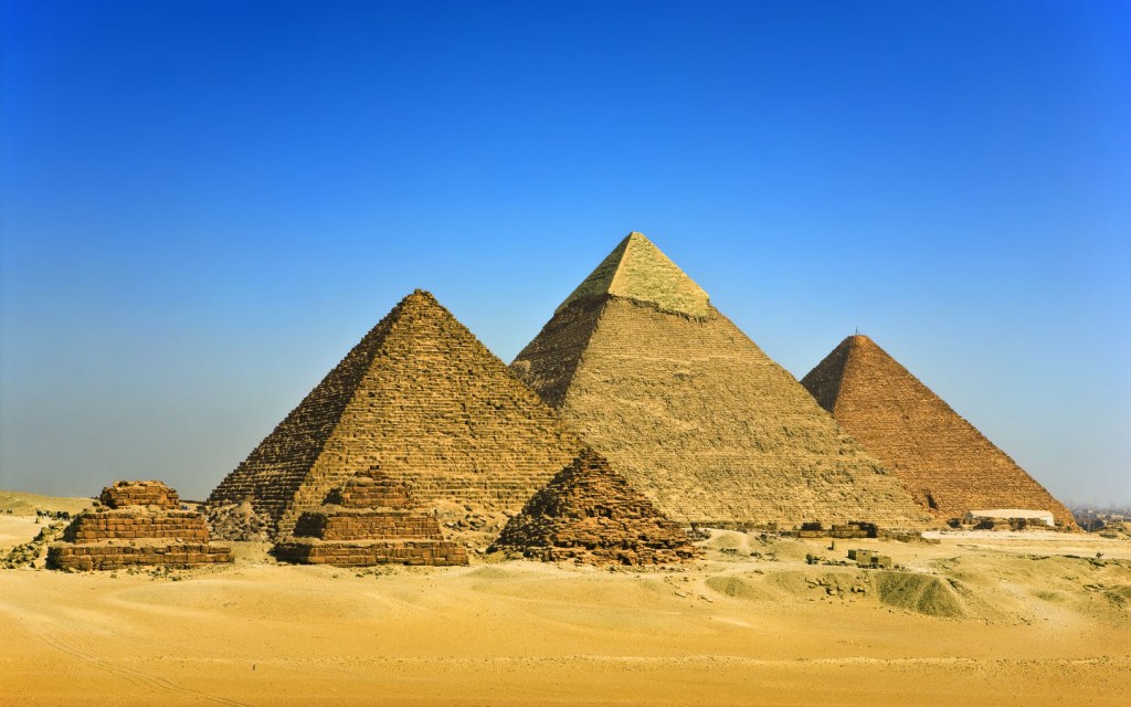 The Great Pyramids in Giza are visited by thousands of tourists each year.