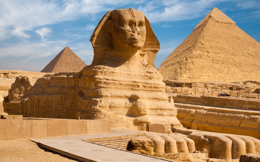 The Sphinx stands guard over the surrounding desert