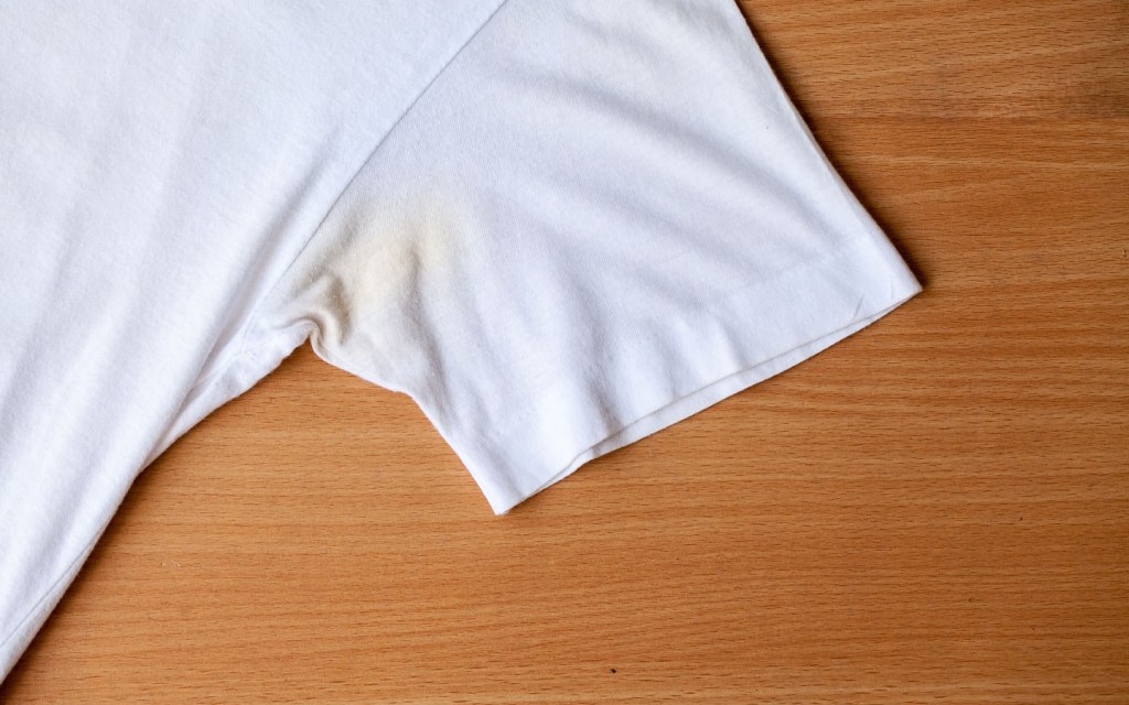 Remove yellow stains from clothing using a white vinegar mixture to soak them overnight