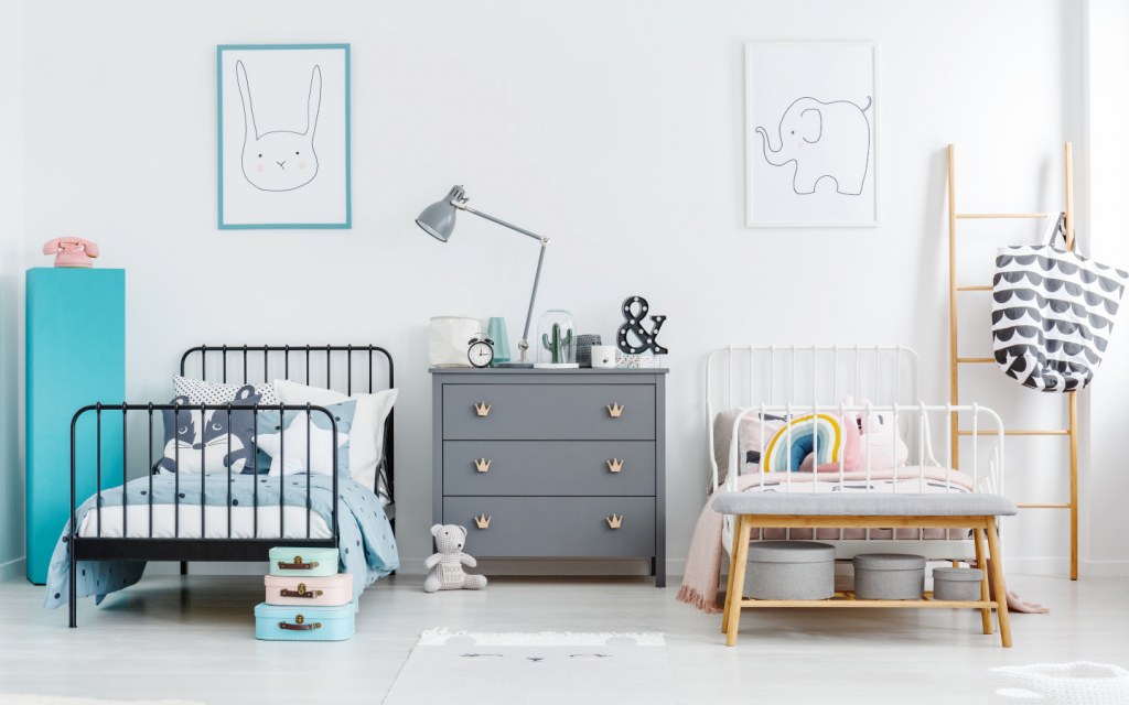 Use neutral tones like white or grey to create unisex rooms for both boys and girls
