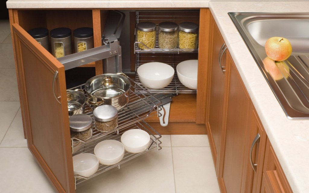 Extend your countertop by clearing out jars and bottles and placing them inside your cabinets