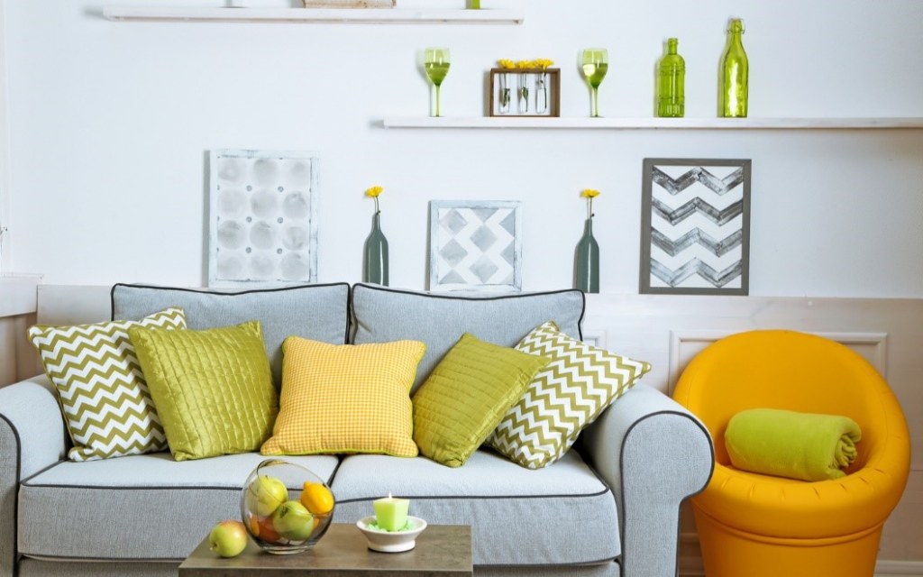 A grey, lime green, and yellow colour palette in a living room