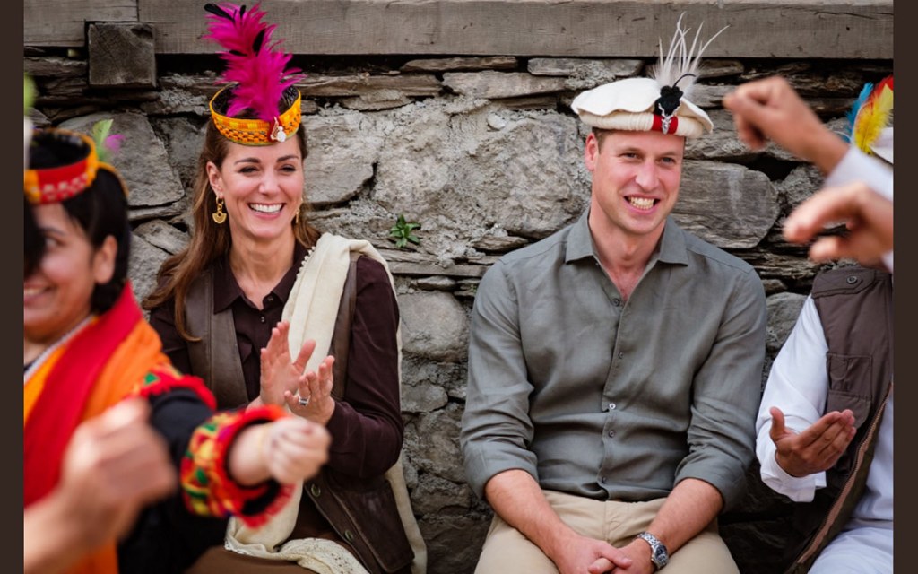 Prince William and Princess Kate Middleton wearing traditional Chitrali hats